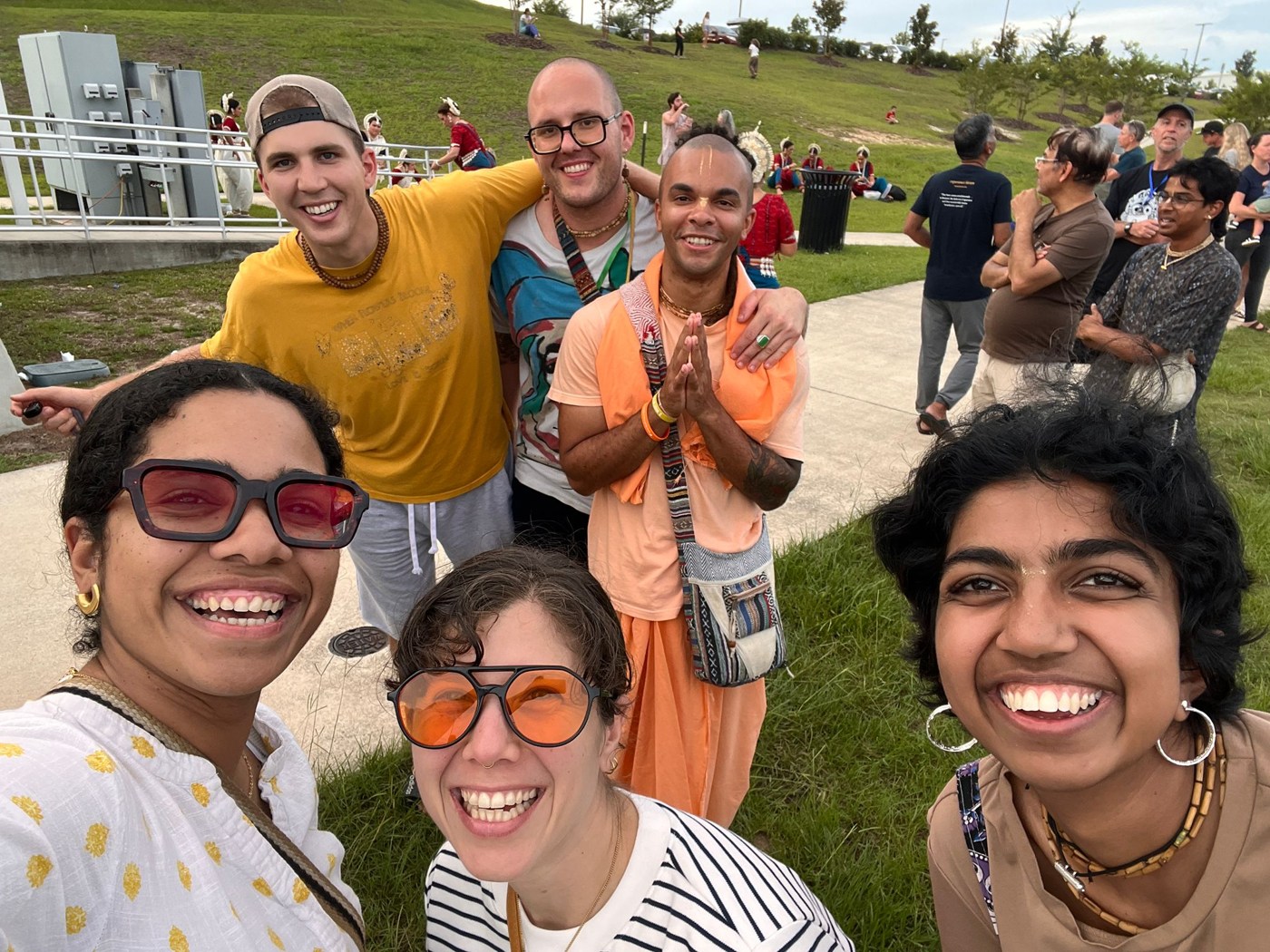 Krishna House devotees smiling together at Bhanu the rapper’s concert