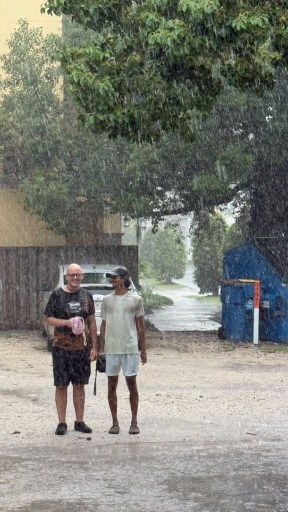 Bobi and Kavi chanting in the rain